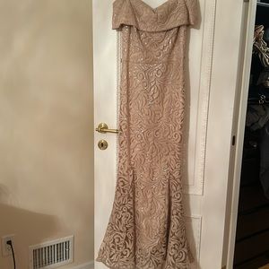 Nicole Bakti Nude of shoulder evening gown with sequins.